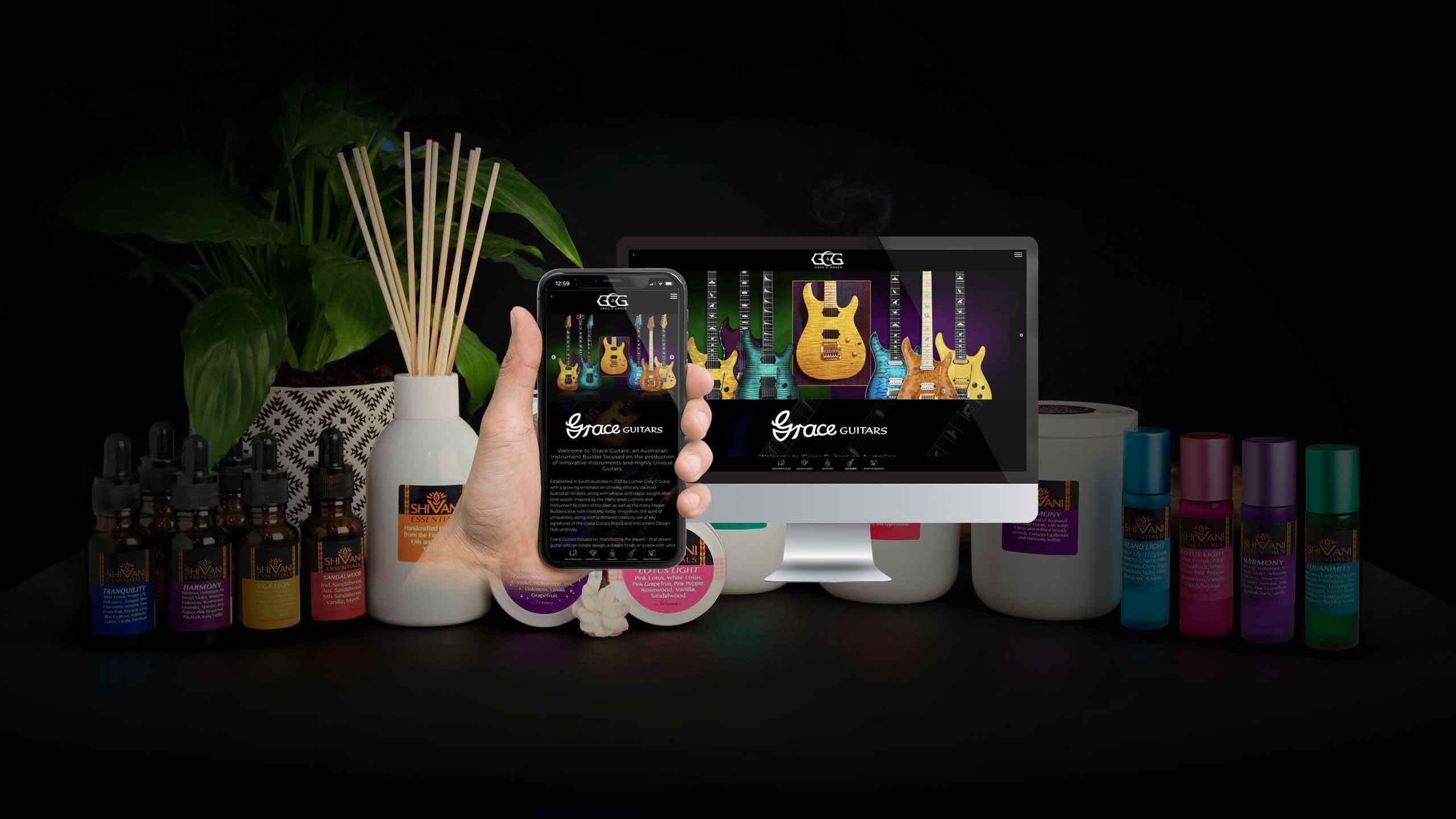 Grace Guitars website mockup displayed among Shivani Essentials fragrance products