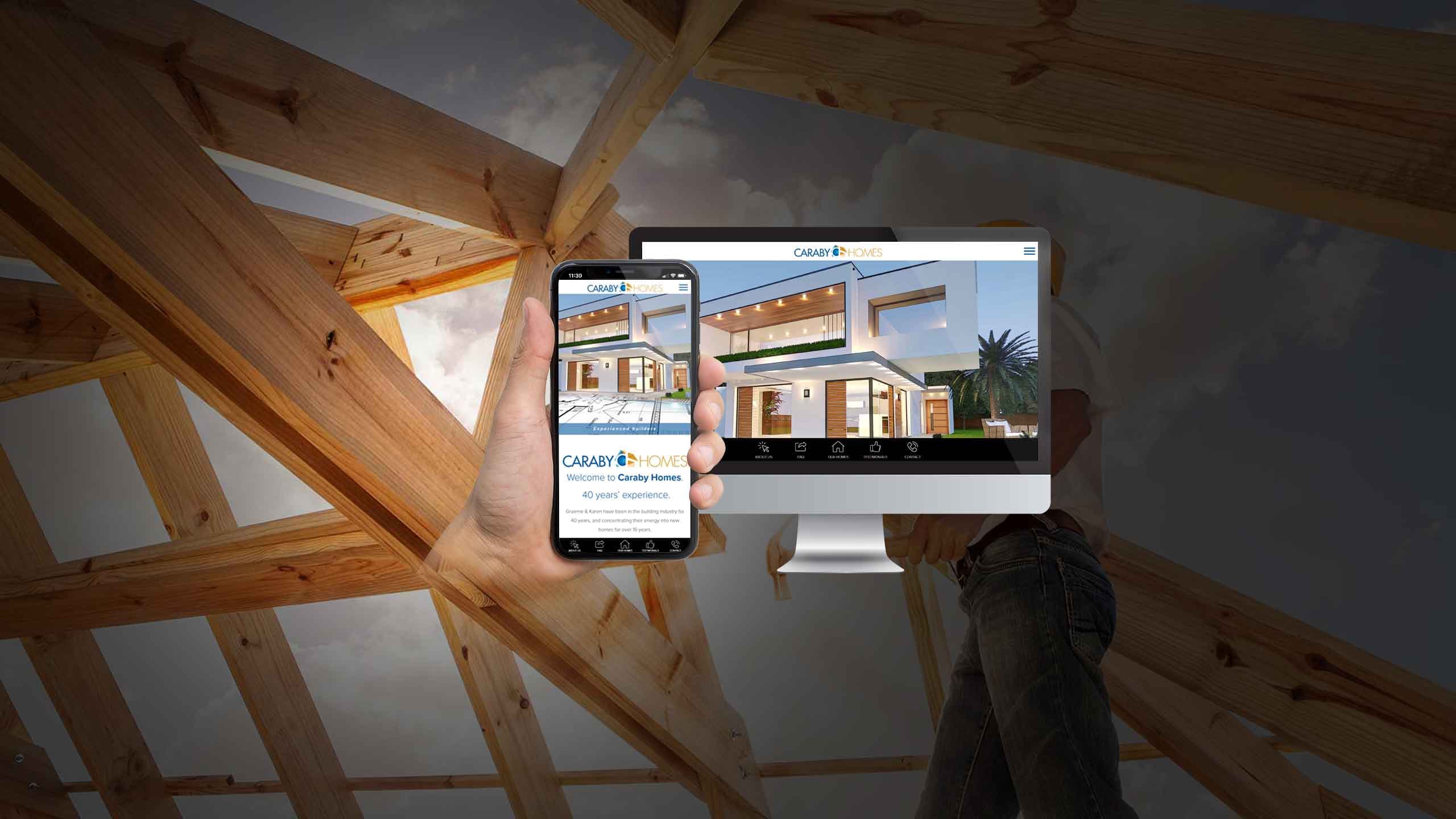 Caraby Homes website homepage on desktop and smartphone inside a house under construction