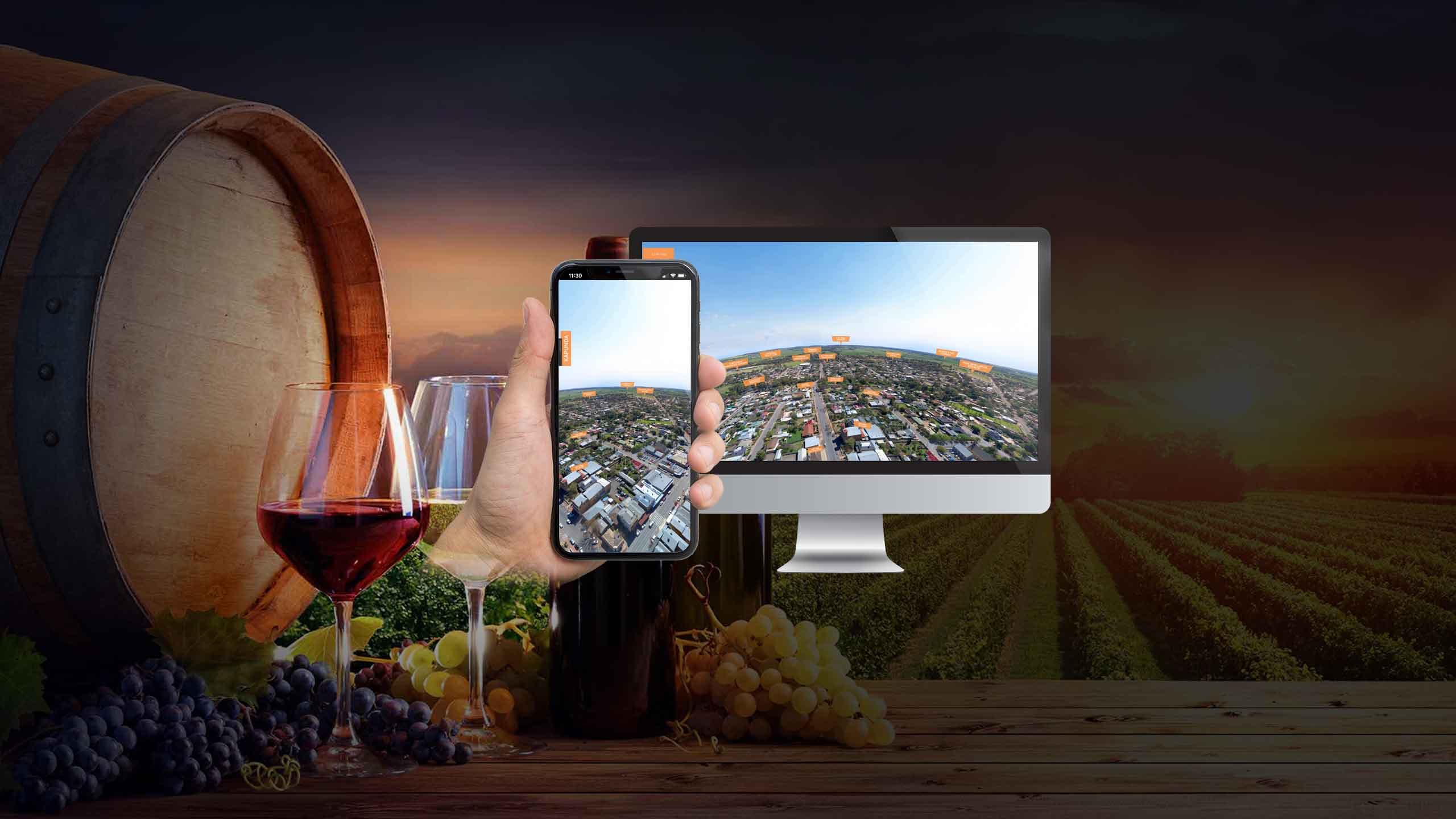 Light Invest aerial town view page shown on a desktop monitor and smartphone against a forest scene