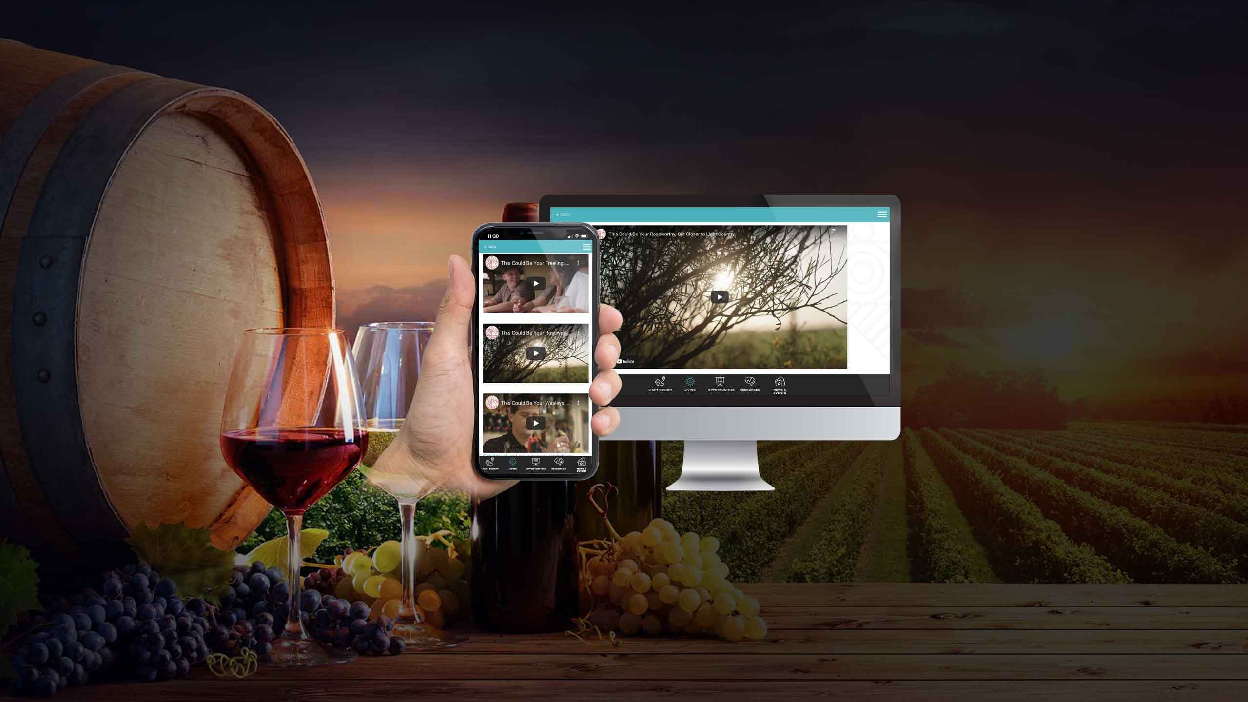 Light Invest Live page shown on a desktop monitor and smartphone beside a wine barrel and grapes