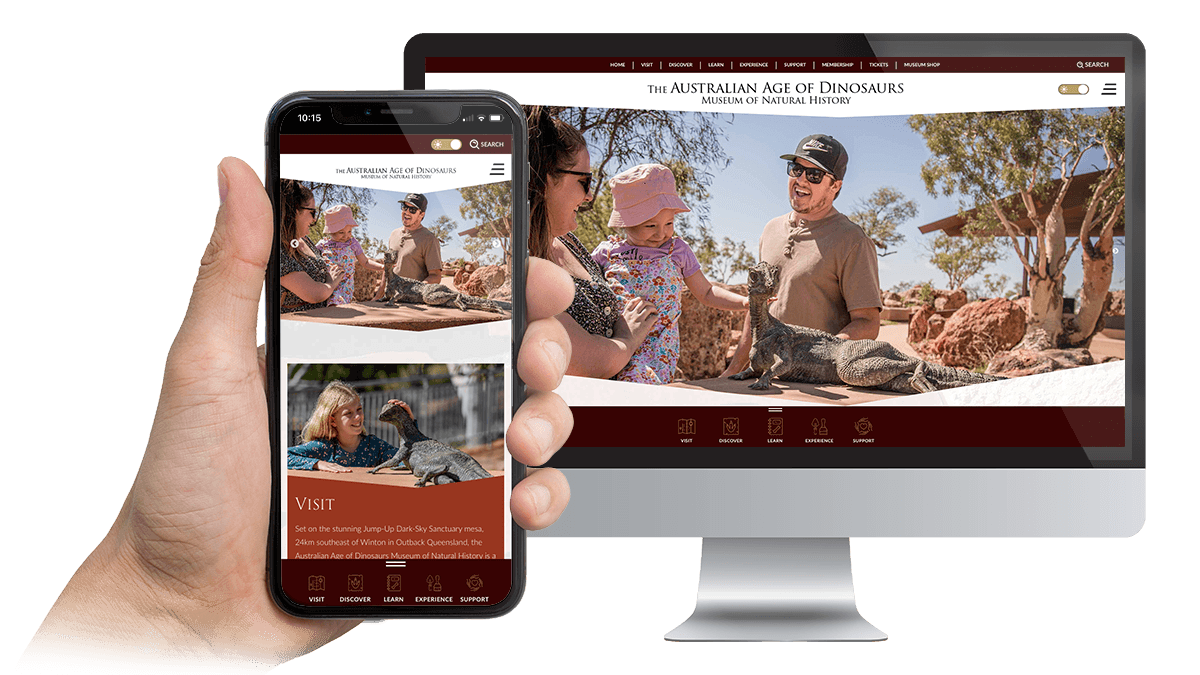 Australian Age of Dinosaurs website Visit page displayed on a desktop monitor and smartphone
