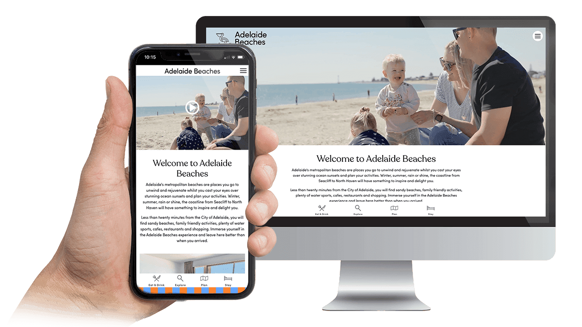 Adelaide Beaches website homepage displayed on a desktop monitor and smartphone