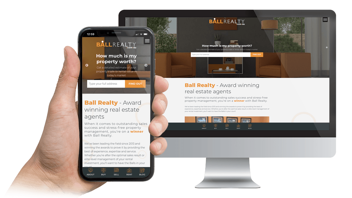 Ball Realty website displayed on a desktop monitor and smartphone