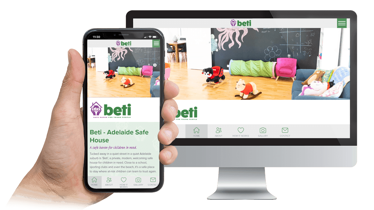 Beti Adelaide Safe House website homepage on a desktop monitor and smartphone, showing a children's playroom