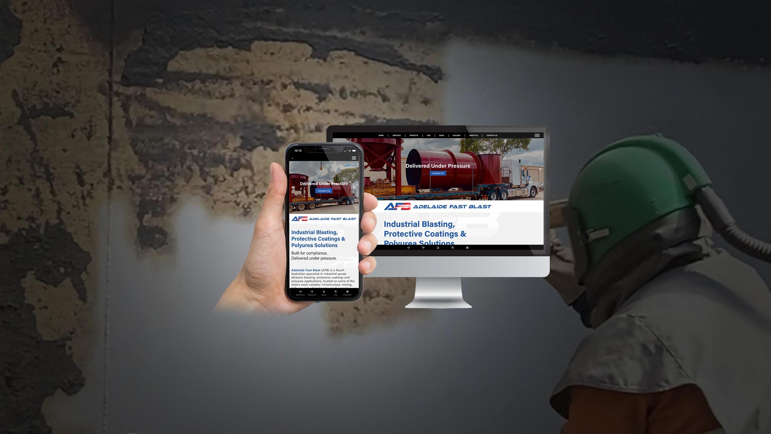 Adelaide Fast Blast website shown on a desktop monitor and smartphone against a weathered concrete wall