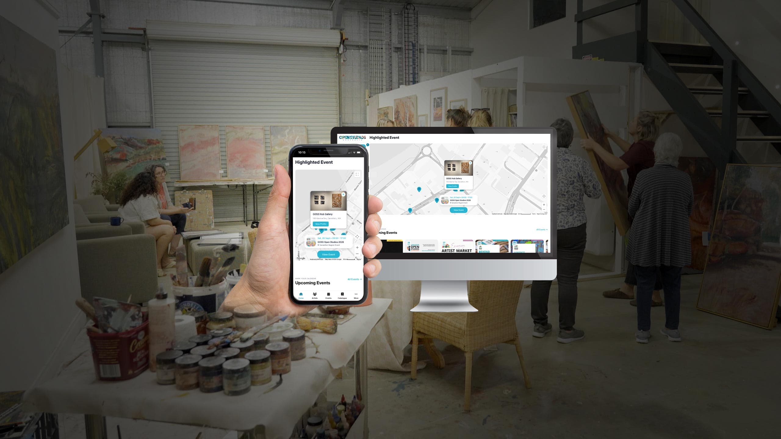 Open Studios Australia highlighted event map on a monitor and phone, in an artist's studio with paintings and paint pots