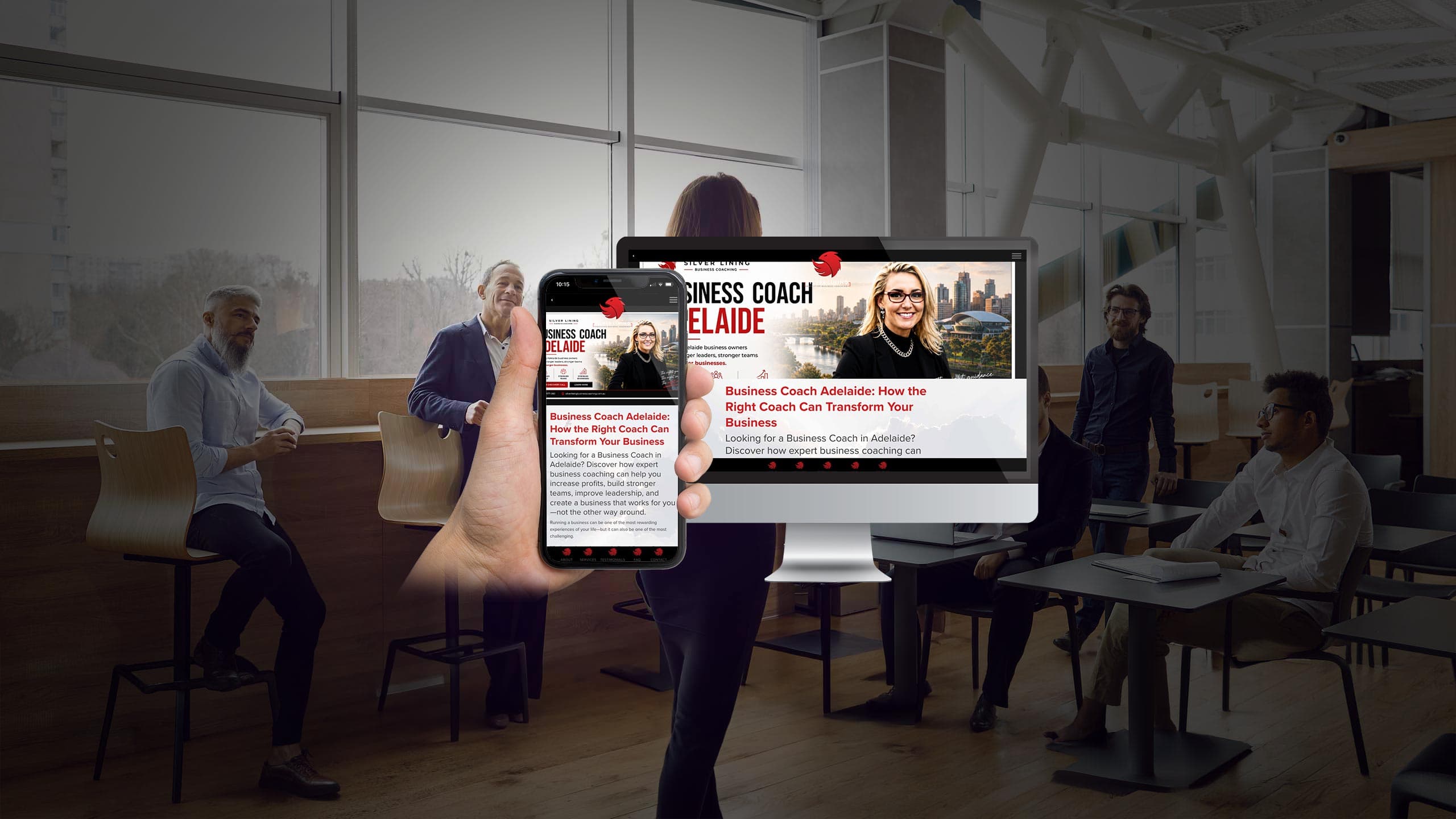 Silver Lining Business Coaching website on desktop and smartphone held up in an office meeting