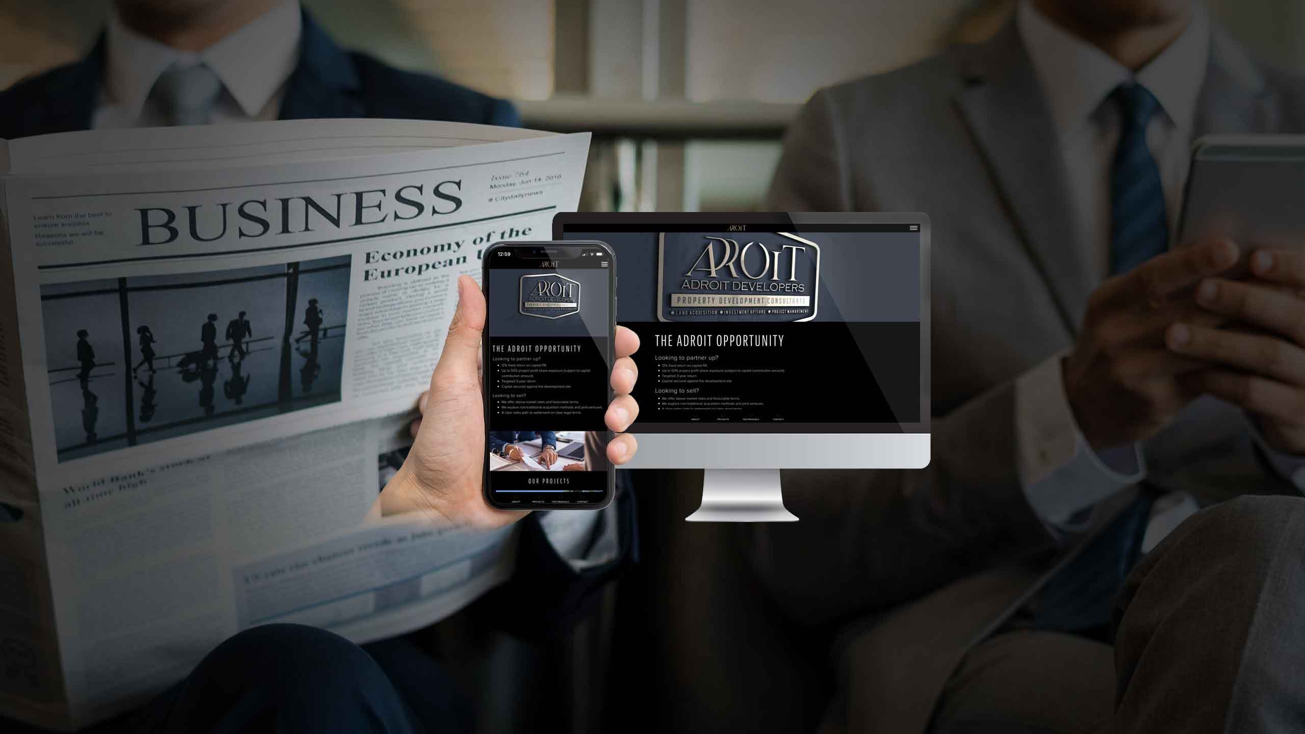 Adroit Developers website shown on a desktop monitor and smartphone held by a businessman reading the news