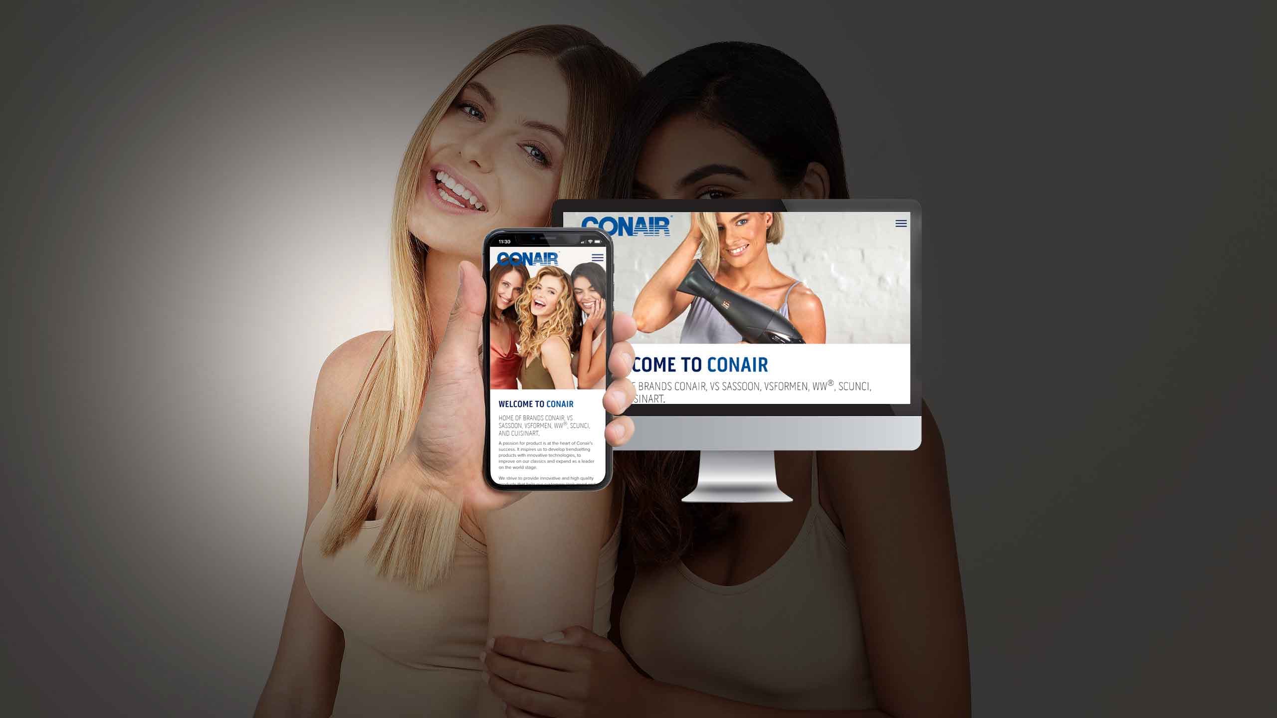Conair website displayed on a desktop monitor and smartphone against a backdrop of two women