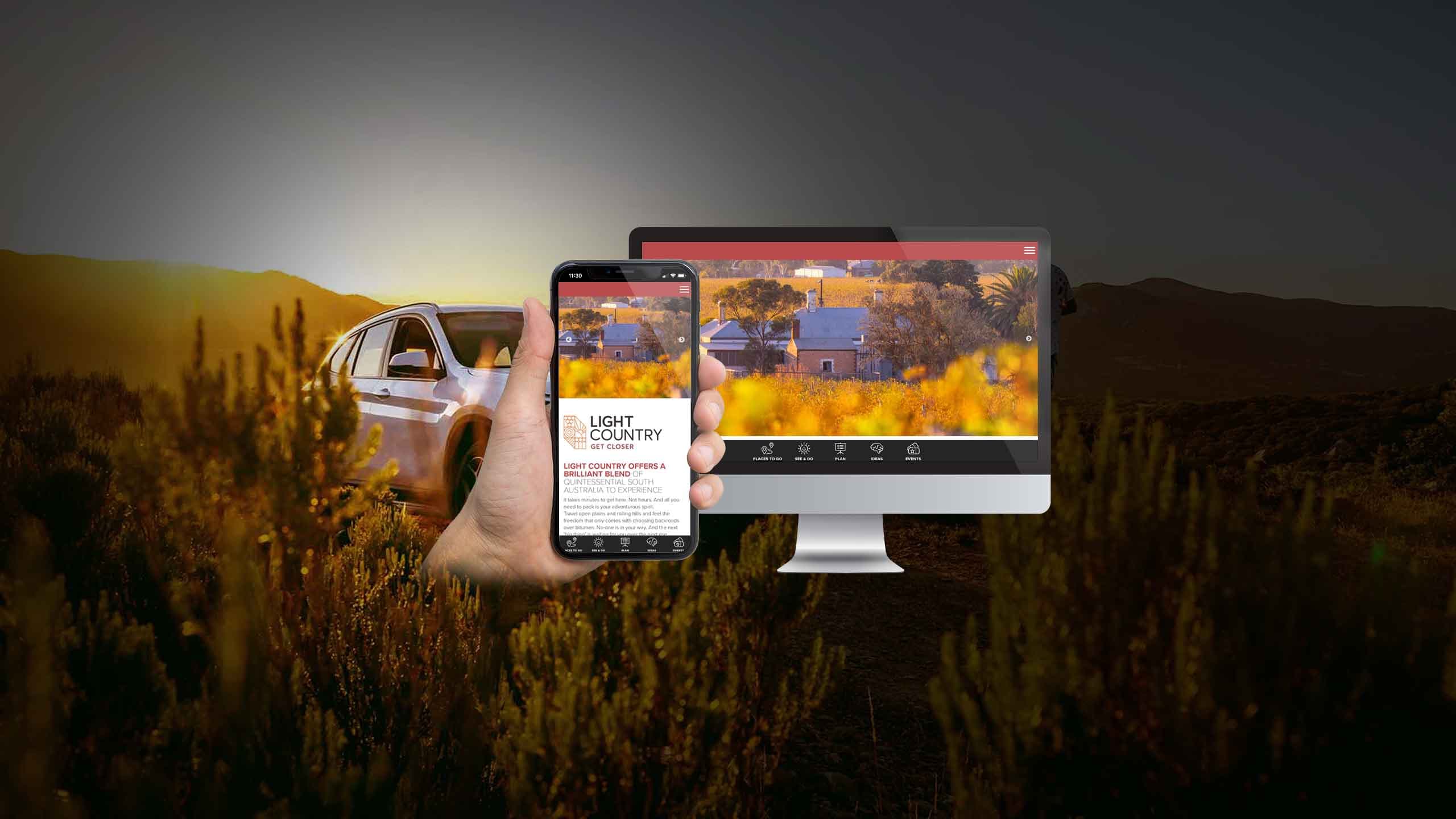 Light Country homepage displayed on a desktop monitor and smartphone, Barossa vineyard at sunset