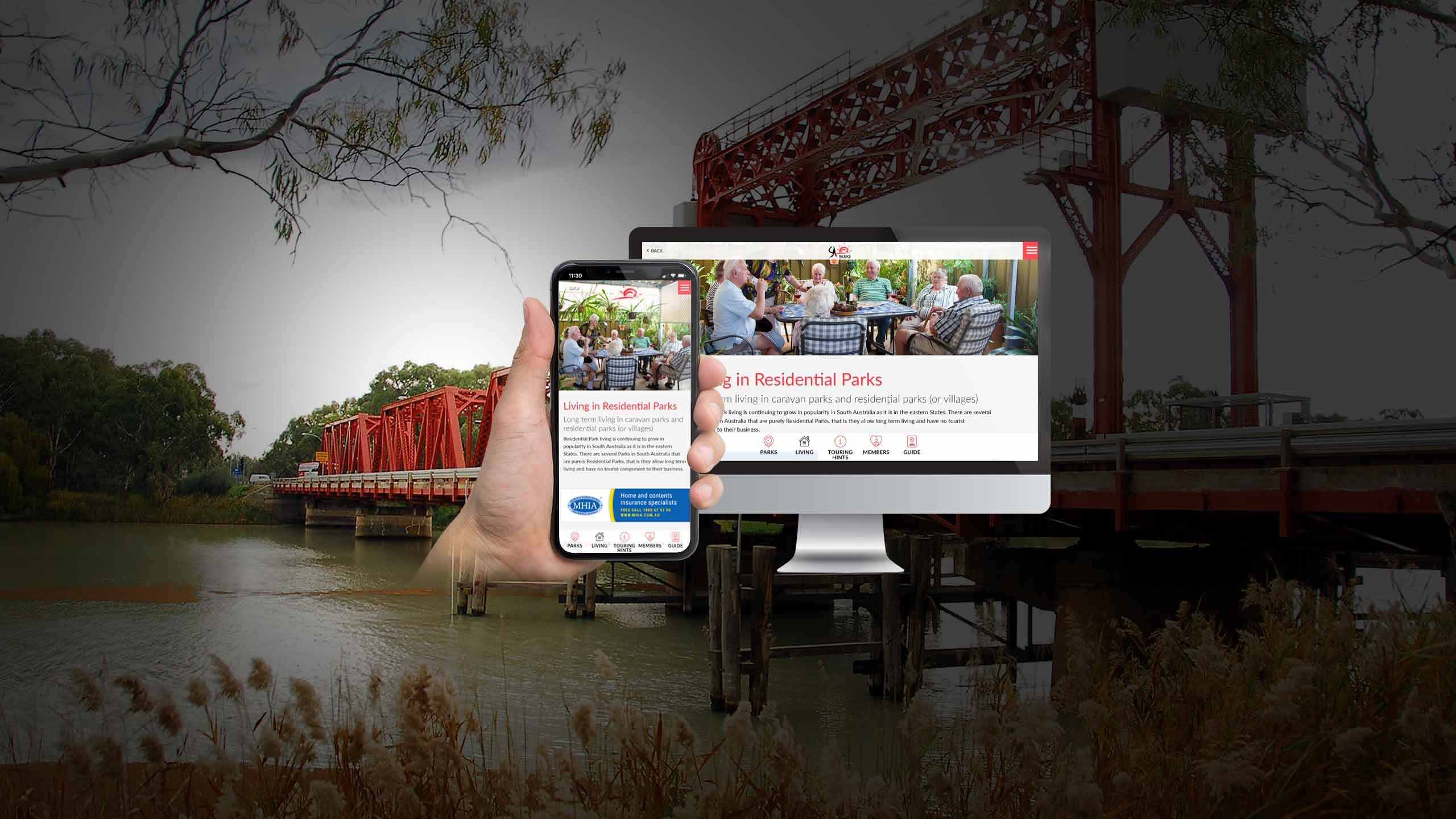 SA Parks website Living in Residential Parks page on a desktop monitor and smartphone by a river bridge