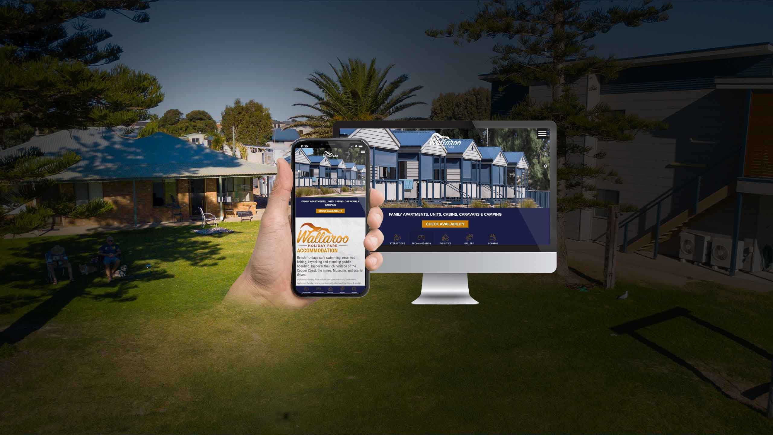 Wallaroo Holiday Park website homepage on a desktop monitor and smartphone in front of the holiday cabins